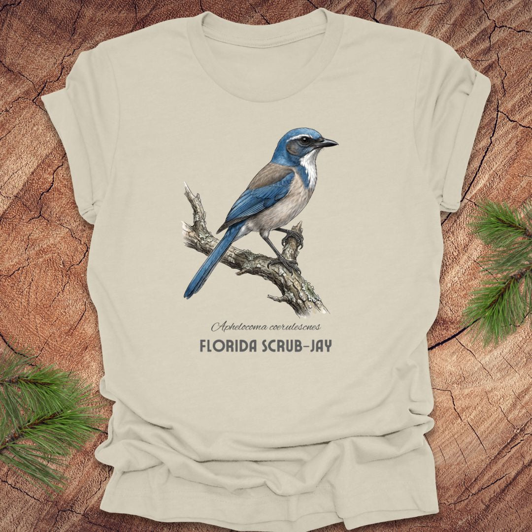 Beige t-shirt with Florida Scrub-Jay design on a wooden surface