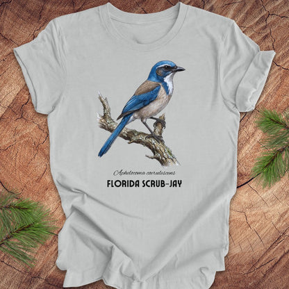 Gray t-shirt with Florida Scrub-Jay graphic on a wooden surface