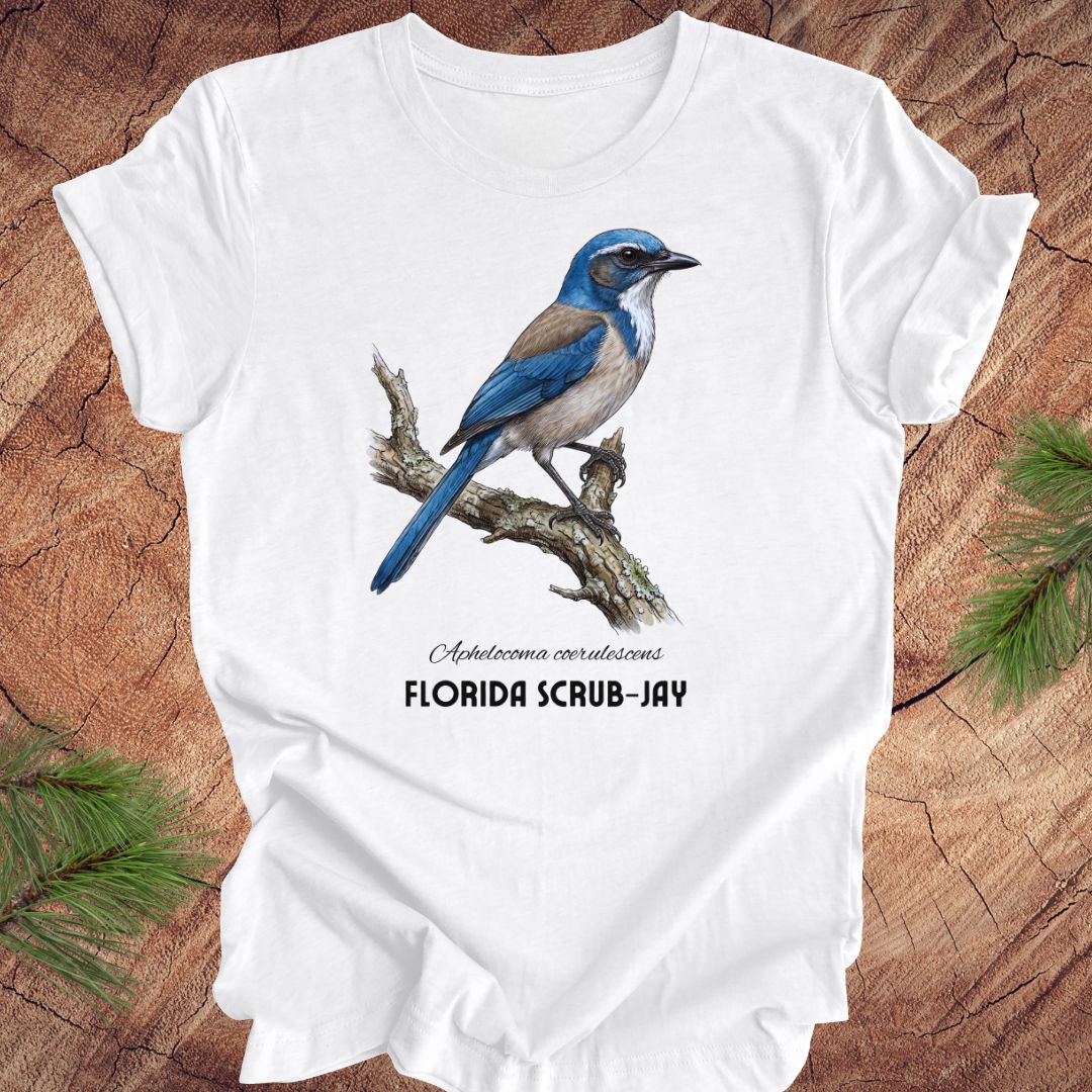 White t-shirt with Florida Scrub-Jay design on a wooden surface