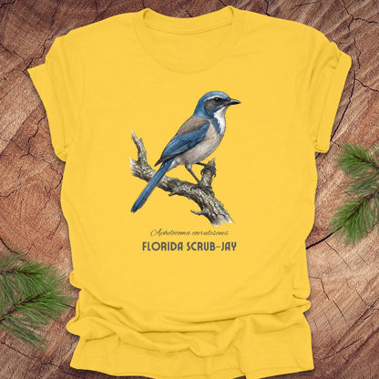 Yellow t-shirt with a Florida Scrub-Jay design on a wooden background