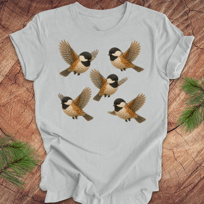 gray t-shirt with 5 flower chickadees on a wood background.