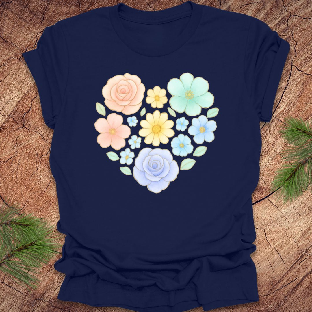 Navy blue t-shirt with a heart-shaped floral design on a wooden surface.