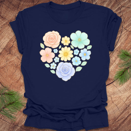 Navy blue t-shirt with a heart-shaped floral design on a wooden surface.