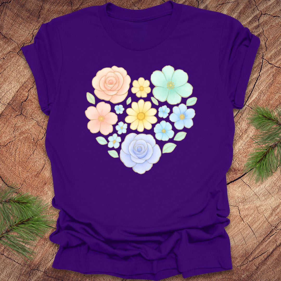 Purple t-shirt with a heart-shaped floral design on a wooden surface
