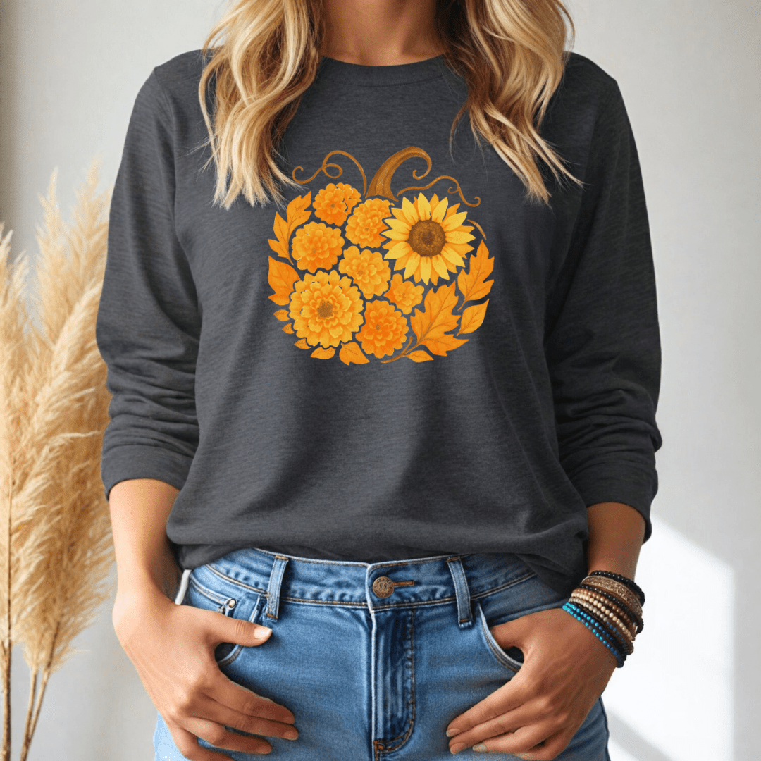 Person wearing a dark gray long sleeve tshirt with a pumpkin sunflower design, standing against a neutral background.