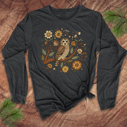 Dark gray long-sleeve shirt with an owl and floral design on a wooden surface.