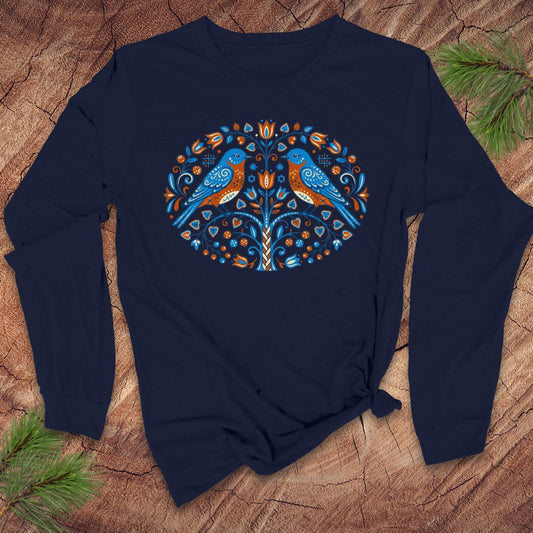 Navy blue long-sleeve tshirt with a colorful bird design on a wooden surface