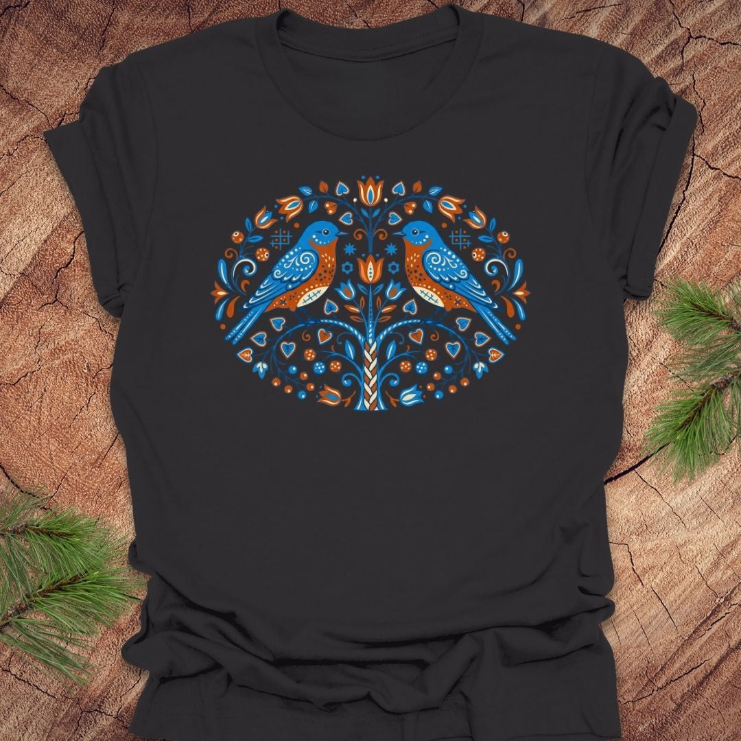 Dark gray t-shirt with a colorful bird design on a wooden surface