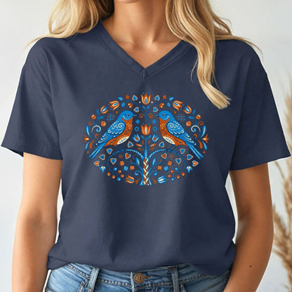 Navy blue t-shirt with a colorful bird design worn by a person.