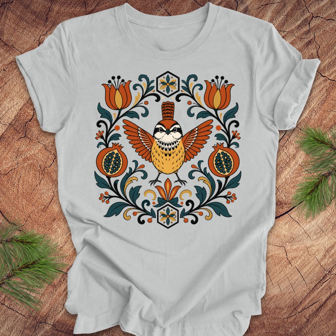 Gray t-shirt with a carolina wren and floral design on a wooden surface