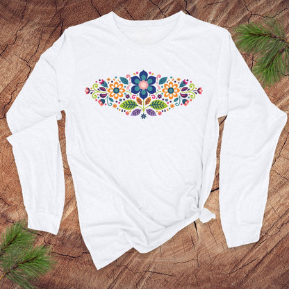 White long-sleeve t-shirt with a vibrant floral pattern in an oval shape, on a wooden background.