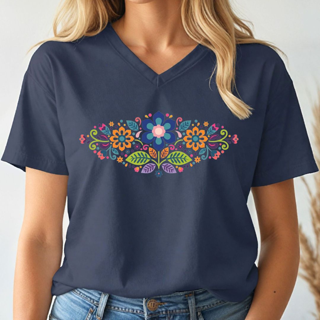 Navy blue t-shirt with colorful folk art floral design worn by a person