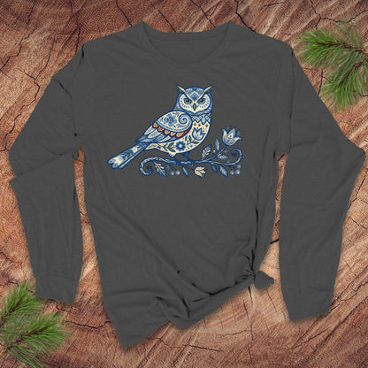 Dark gray long-sleeve shirt with a blue folk art floral owl design on a wooden surface.