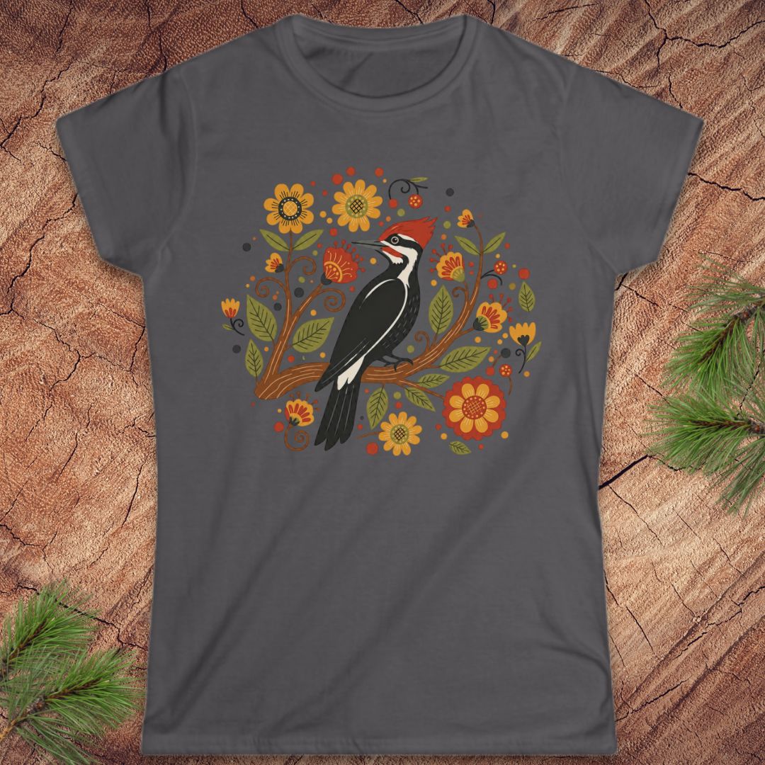Dark gray t-shirt with a woodpecker and floral design on a wood background.