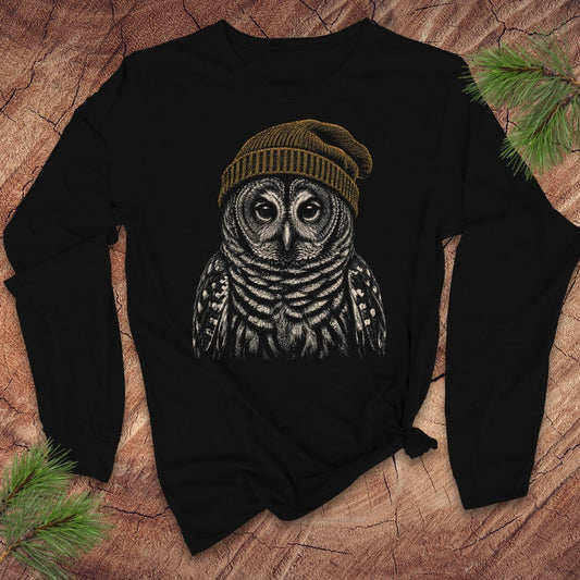Black long-sleeve tshirt with an owl wearing a beanie on wood  background