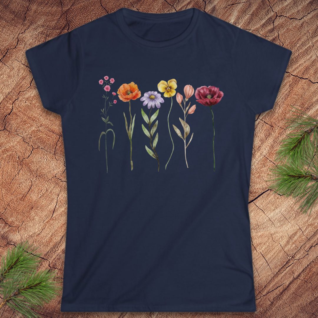 Navy blue t-shirt with colorful floral design on a wooden surface