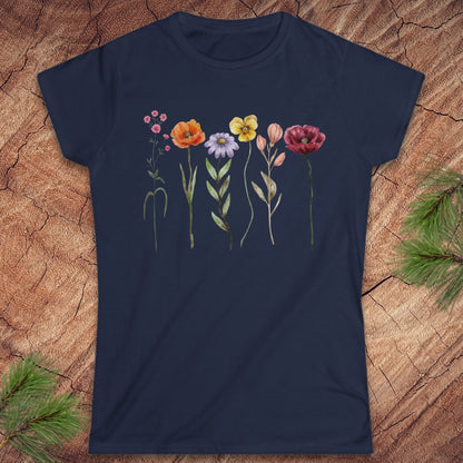 Navy blue t-shirt with colorful floral design on a wooden surface