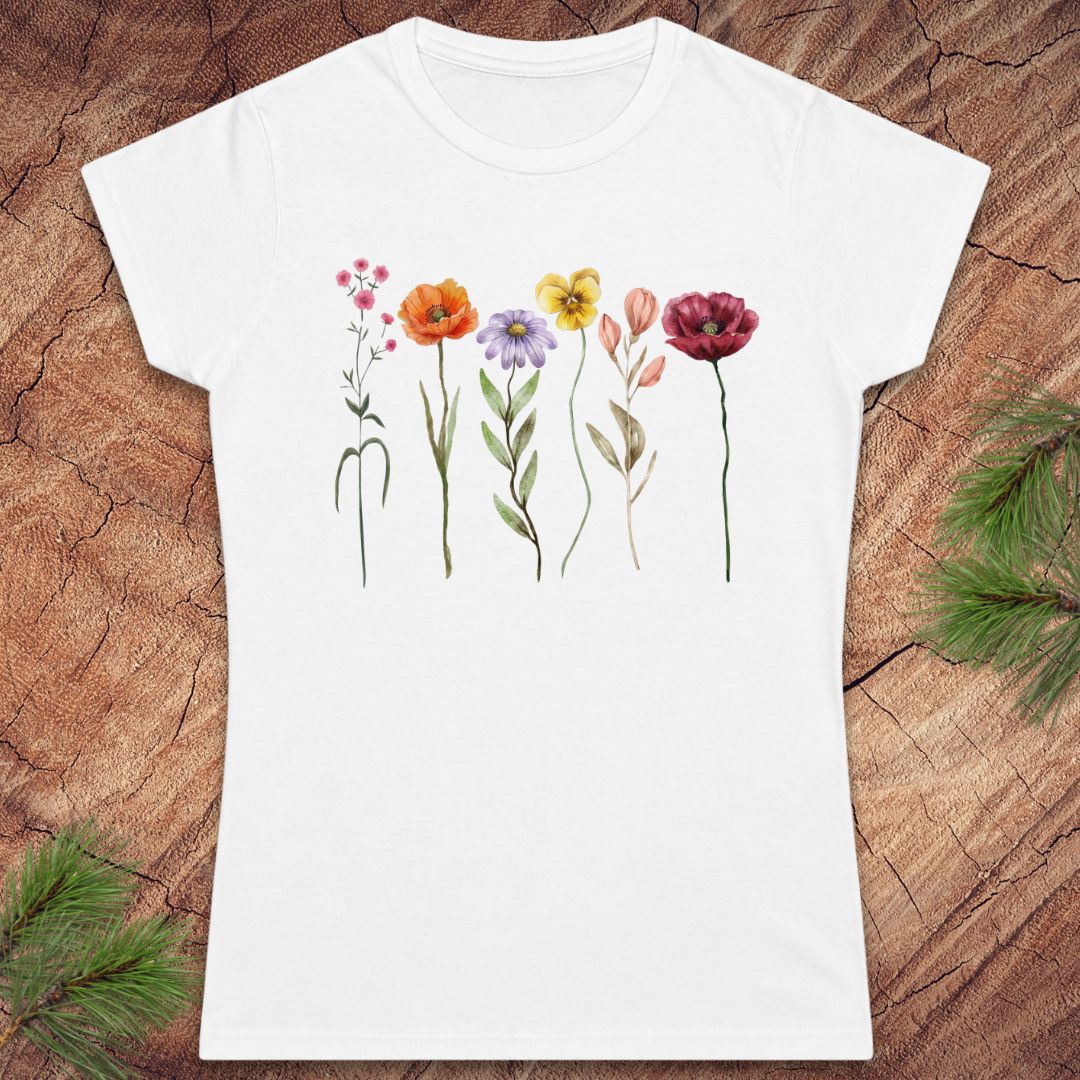 White t-shirt with floral design on a wooden surface