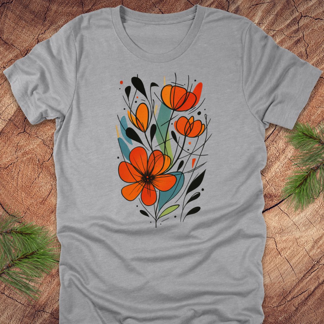Gray t-shirt with orange floral design on a wooden surface