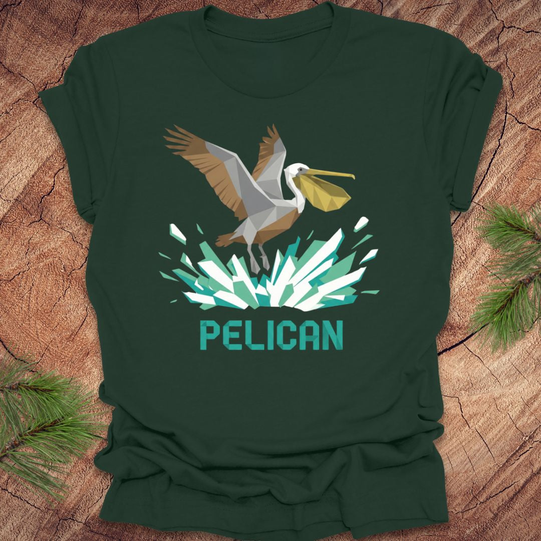 Green t-shirt with a pelican graphic and 'Pelican' text on a wooden surface.