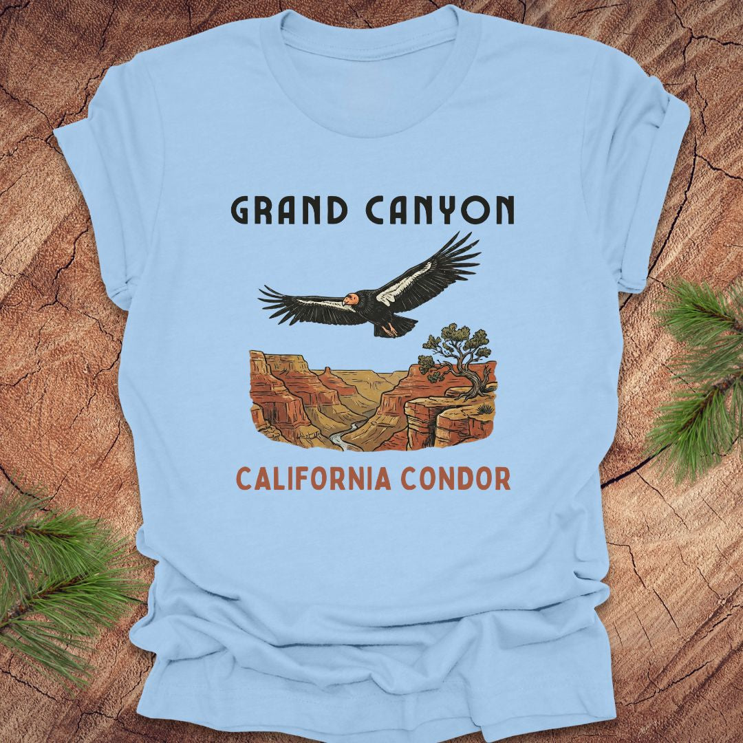 Light blue t-shirt with Grand Canyon and California Condor design on a wooden surface.