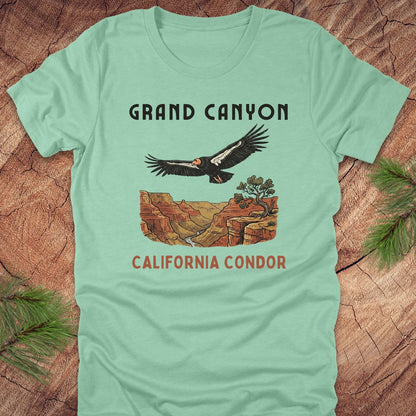 Mint green t-shirt with Grand Canyon and California Condor design on a wooden surface.