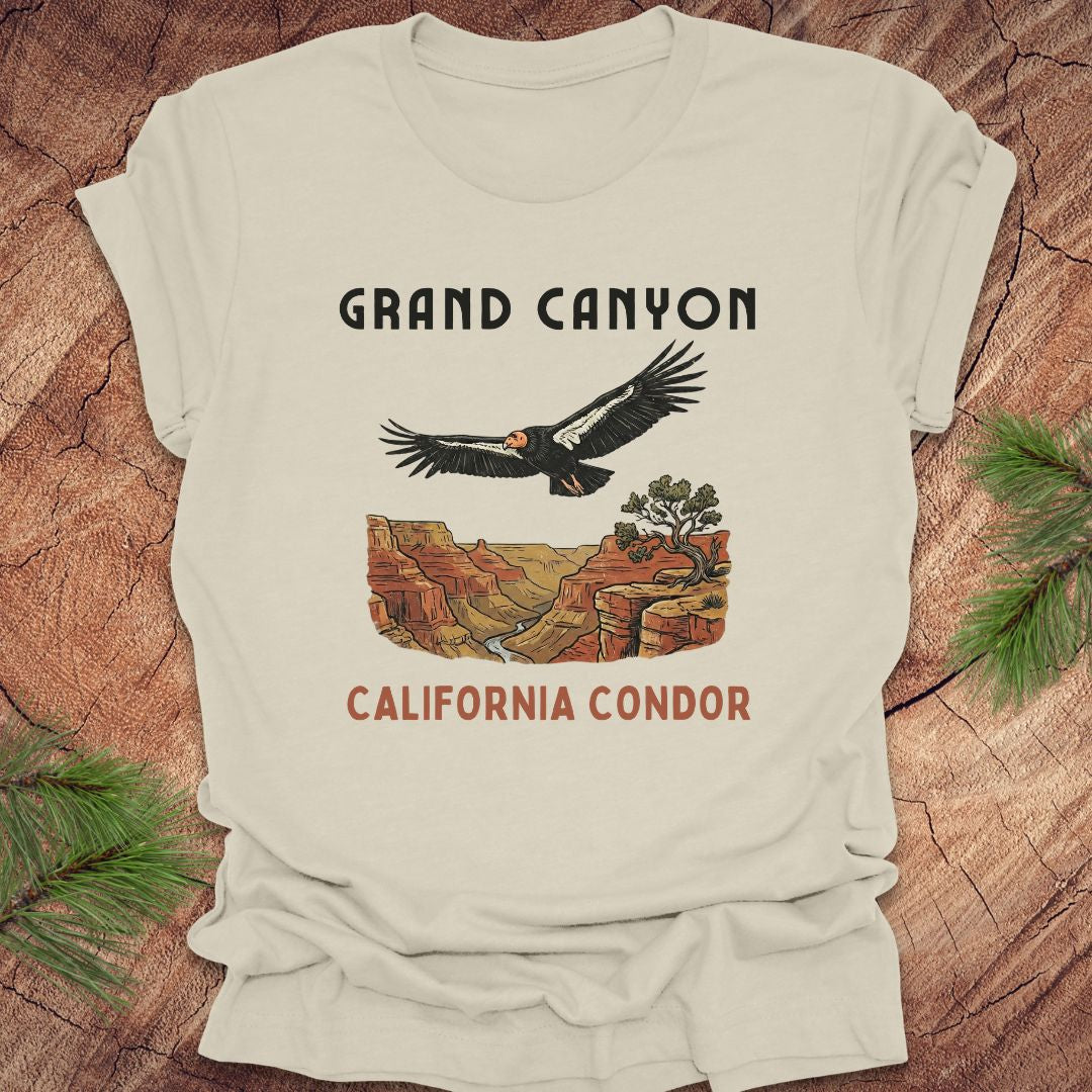 Beige t-shirt with Grand Canyon and California Condor design on a wooden surface.