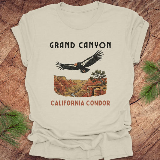 Beige t-shirt with Grand Canyon and California Condor design on a wooden surface.
