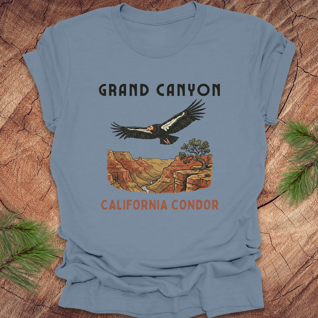 Blue t-shirt with Grand Canyon and California Condor design on a wooden surface.