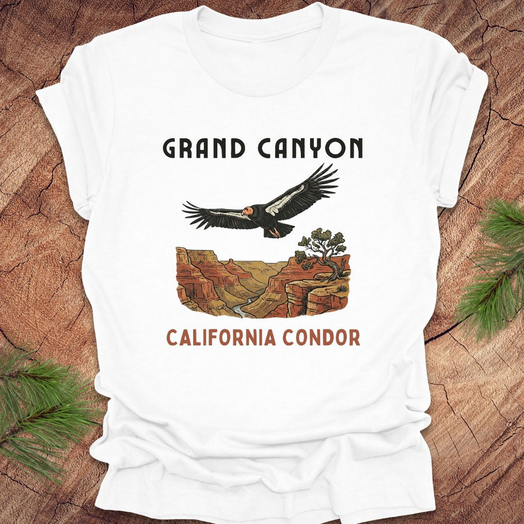White t-shirt with Grand Canyon and California Condor design on a wooden surface.