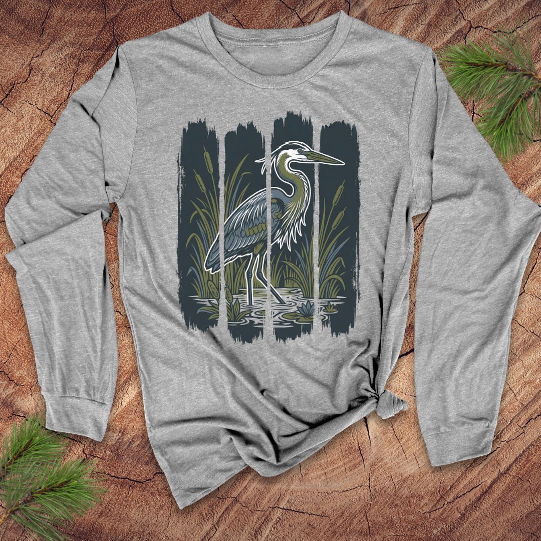 Gray long-sleeve shirt with a heron design on a wooden surface