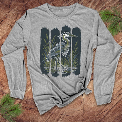 Gray long-sleeve shirt with a heron design on a wooden surface