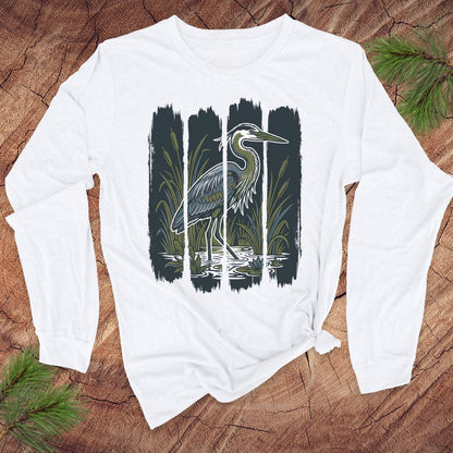 White long-sleeve shirt with a heron design on a wooden surface