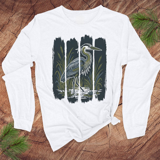 White long-sleeve shirt with a heron design on a wooden surface