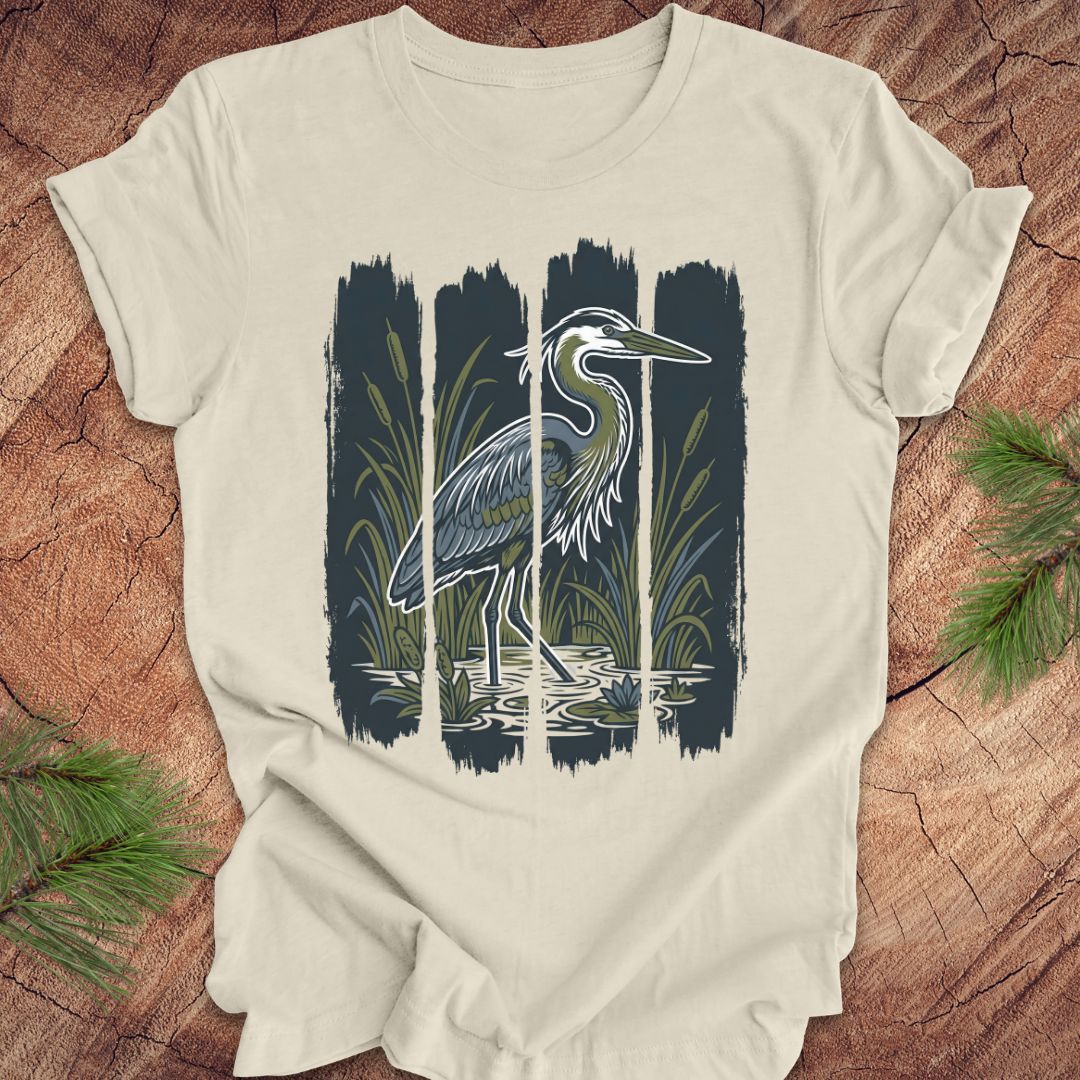 Beige t-shirt with a heron design on a wooden surface