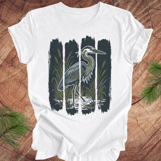 White t-shirt with a heron design on a wooden surface