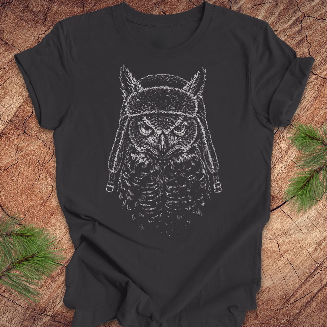 Dark gray t-shirt with an owl graphic on a wooden surface