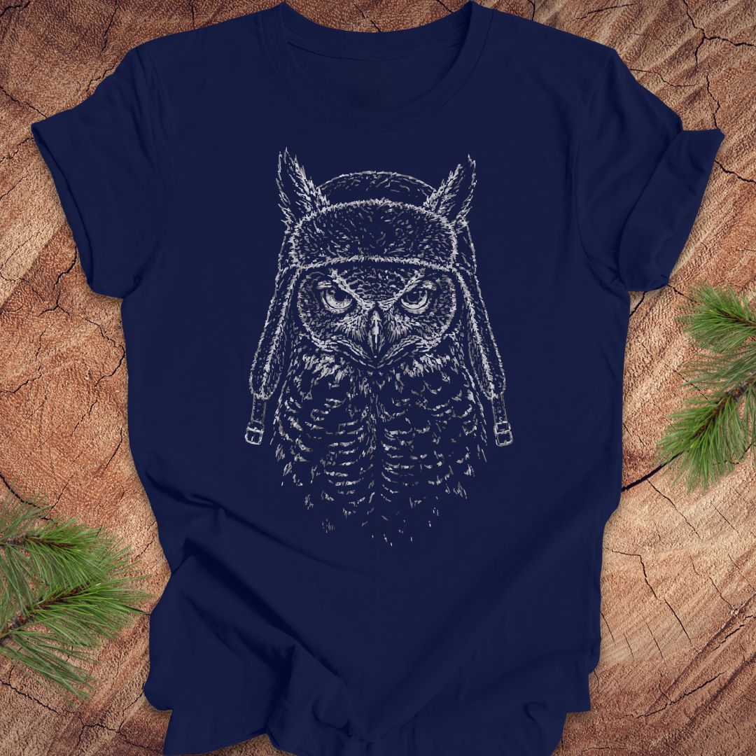 Navy blue t-shirt with an owl graphic on a wooden surface