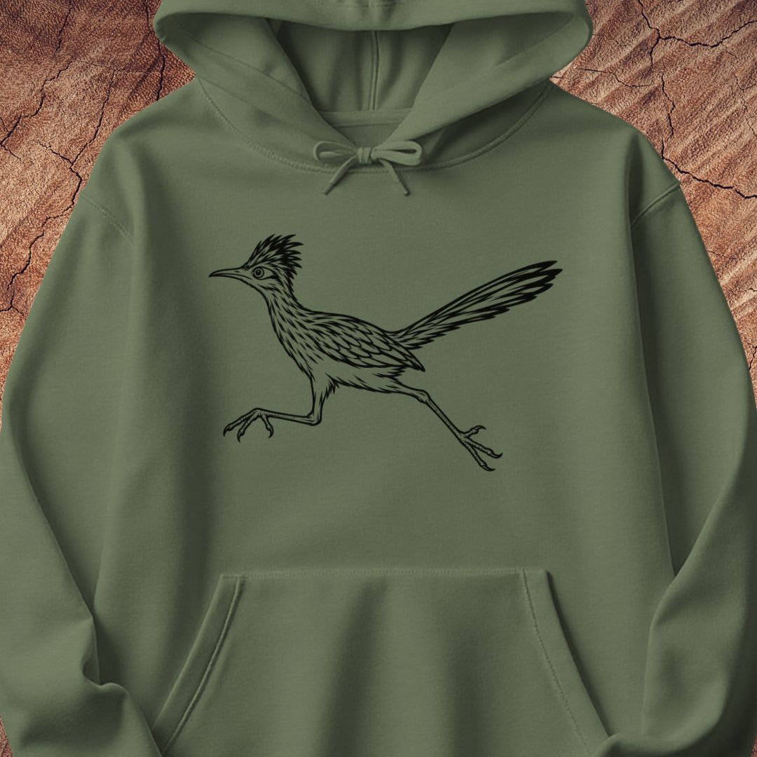 An olive green pullover hoodie featuring a black line art graphic of a running roadrunner bird on the chest, displayed against a textured brown wood background.
