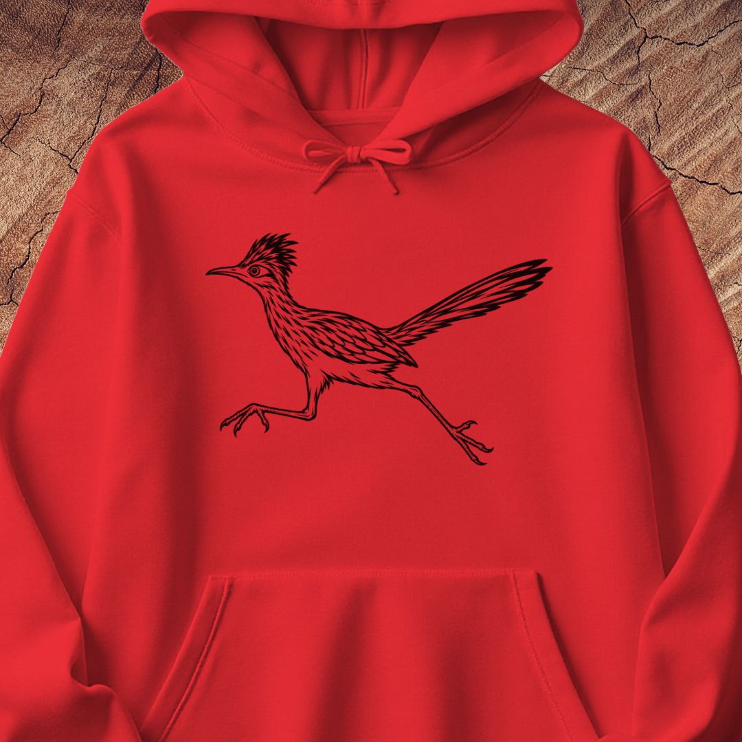 A bright red pullover hoodie with a black line art graphic of a running roadrunner on the chest, displayed flat against a textured brown wood background.