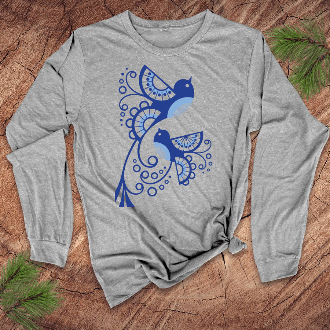 Gray long-sleeve shirt with abstract blue bird design on a wooden surface