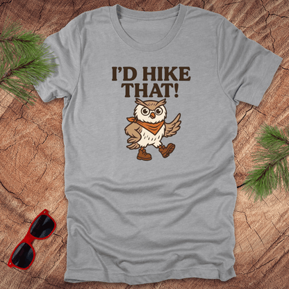 A gray t-shirt with a graphic of an owl wearing a hat and the text 'I'D HIKE THAT!' printed above.