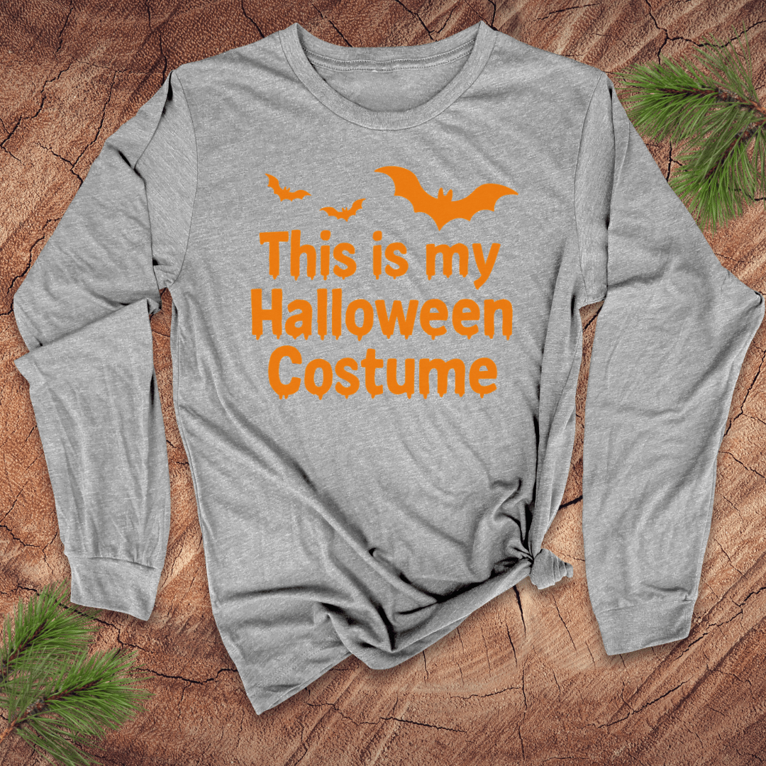 Gray long-sleeve shirt with 'This is my Halloween Costume' text and orange bats on a wooden surface.