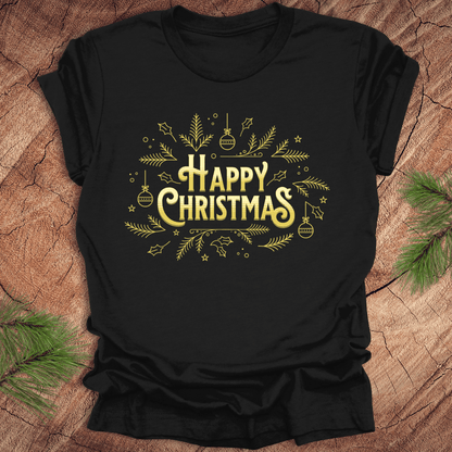 Black t-shirt with 'Happy Christmas' text and pine graphics on a wooden surface with pine branches.