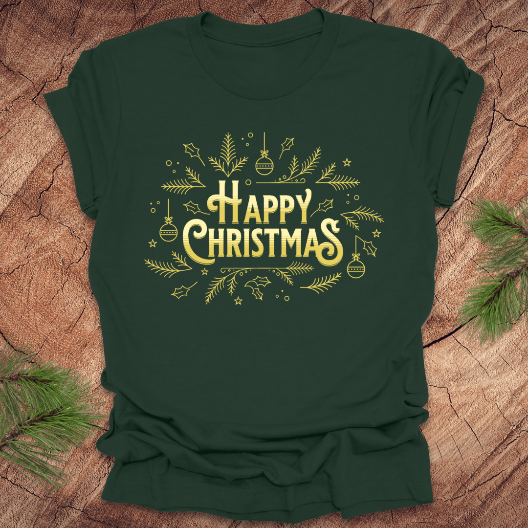 Green t-shirt with 'Happy Christmas' text and pine graphics on a wooden surface with pine branches.