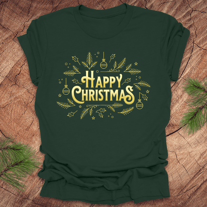 Green t-shirt with 'Happy Christmas' text and pine graphics on a wooden surface with pine branches.