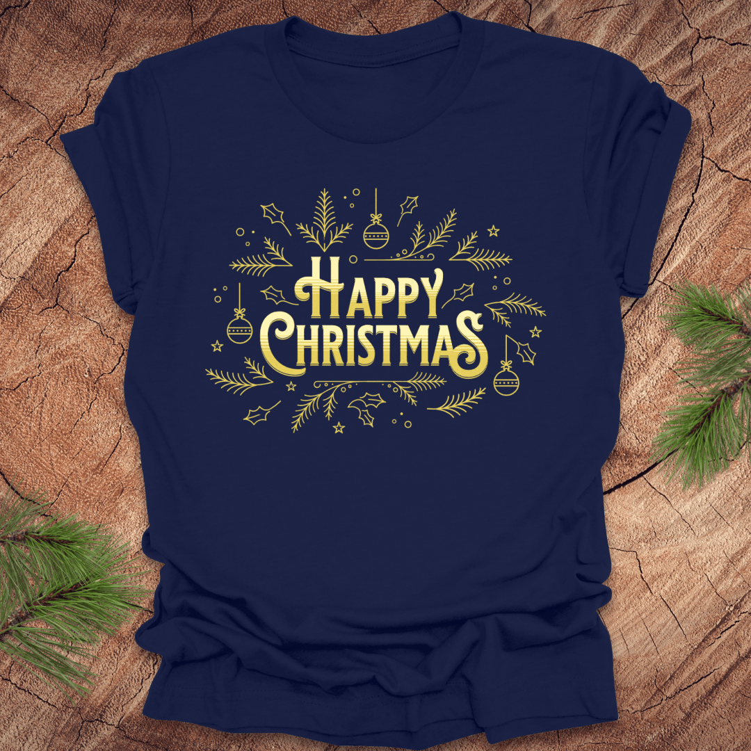 Navy t-shirt with 'Happy Christmas' text and pine graphics on a wooden surface with pine branches.