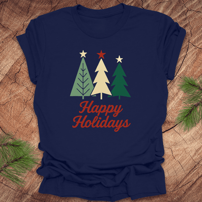 Navy blue t-shirt with Christmas tree design and 'Happy Holidays' text on a wooden surface.
