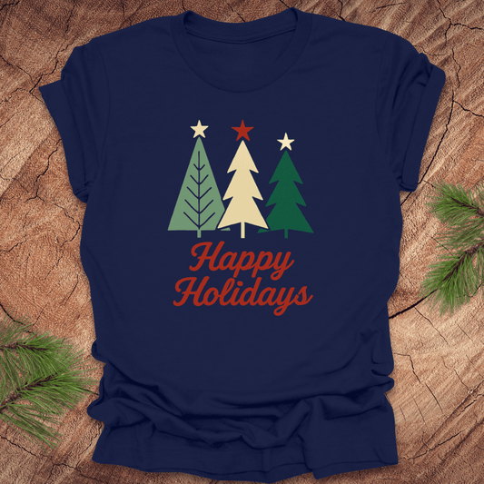 Navy blue t-shirt with Christmas tree design and 'Happy Holidays' text on a wooden surface.