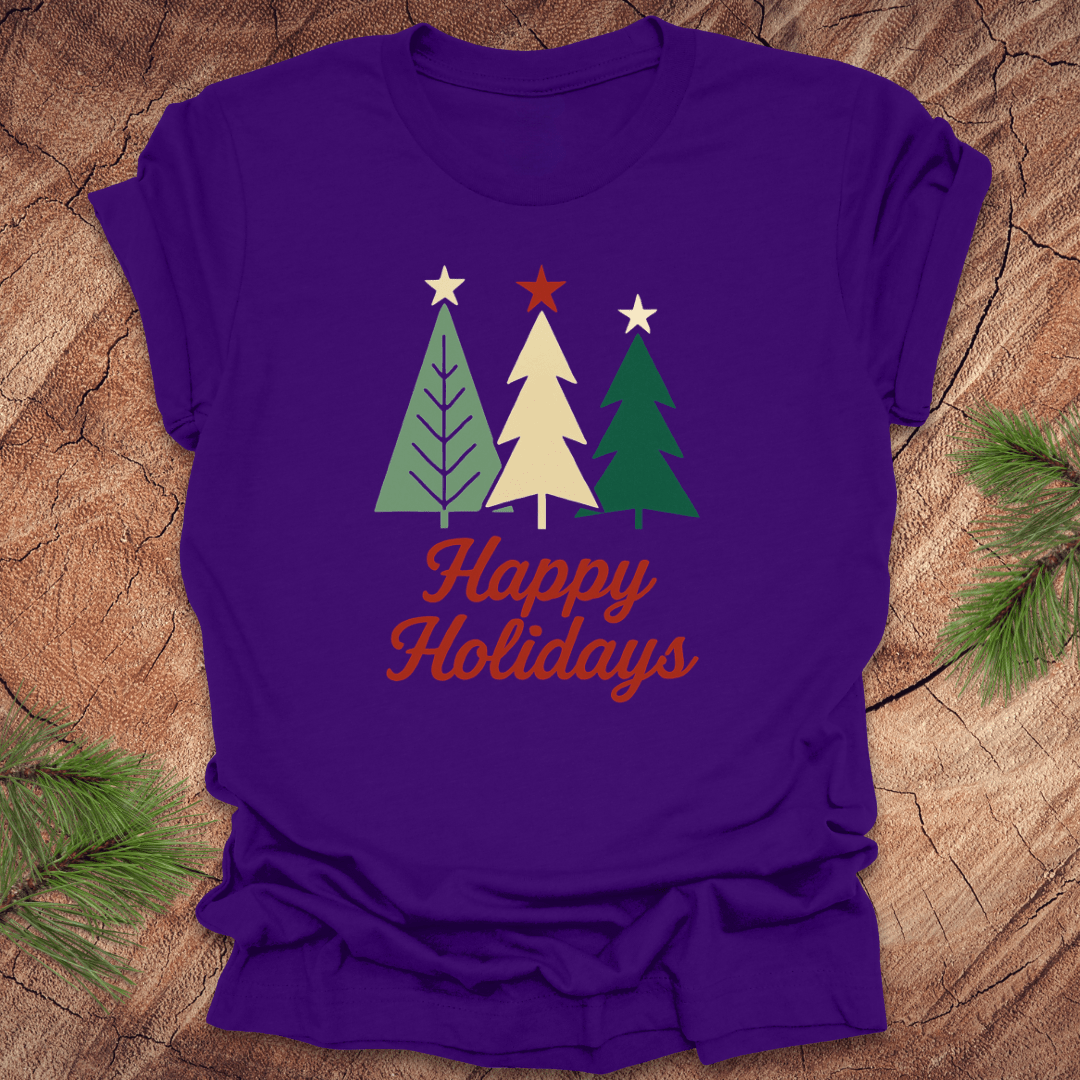 Purple t-shirt with Christmas tree design and 'Happy Holidays' text on a wooden surface.
